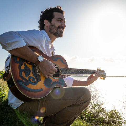 Rue Canal Watch - Cream Dial on Man Playing Guitar near Water